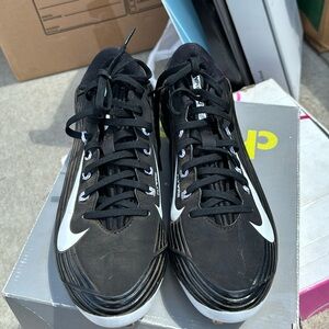 Black-and-white Nike vapor cleats